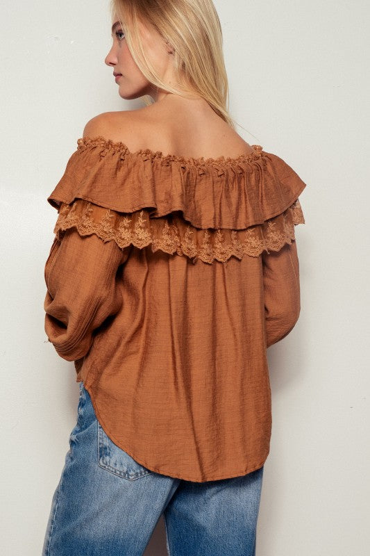 Back View of brown boho ruffle blouse with elastic off-shoulder neckline and flowy silhouette
