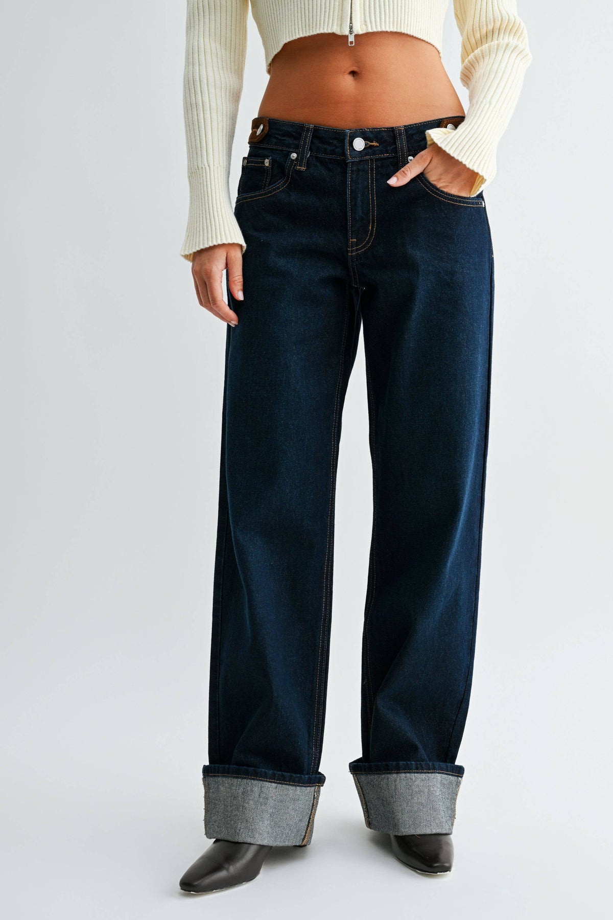 Front view of Midnight Edge Cuffed Jeans in dark indigo denim with relaxed straight legs and oversized rolled cuffs.
