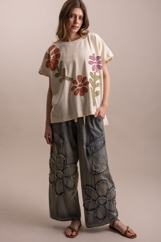 Flower patchwork wide leg denim pants styled with floral appliqué tee — boho luxe matching set