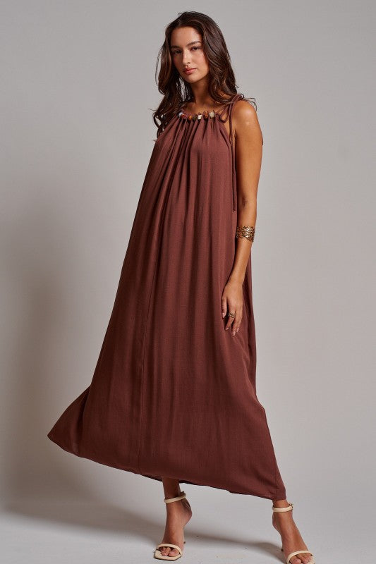Beaded Halter Neck Linen Maxi Dress in light blue with multicolor bead neckline worn without the belt for a loose fit.  worn with strappy heels — Urban Daizy

