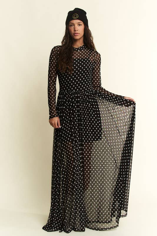 Black polka-dot mesh long-sleeve maxi dress with high neck and flowy, sheer overlay.