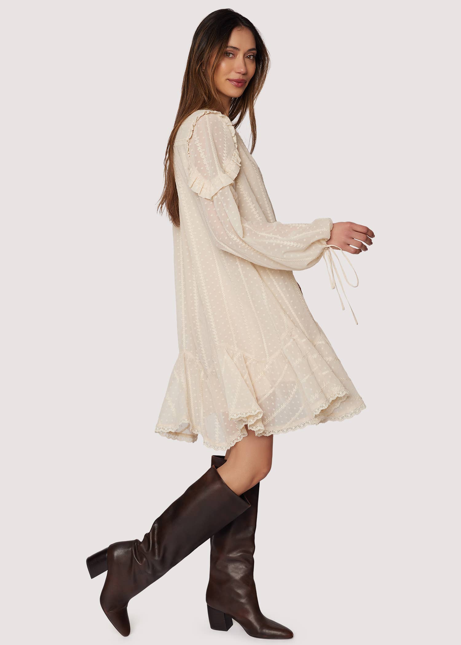Boho ivory mini dress—V-neck, long blouson sleeves with ties, ruffle details, lace-trimmed hem