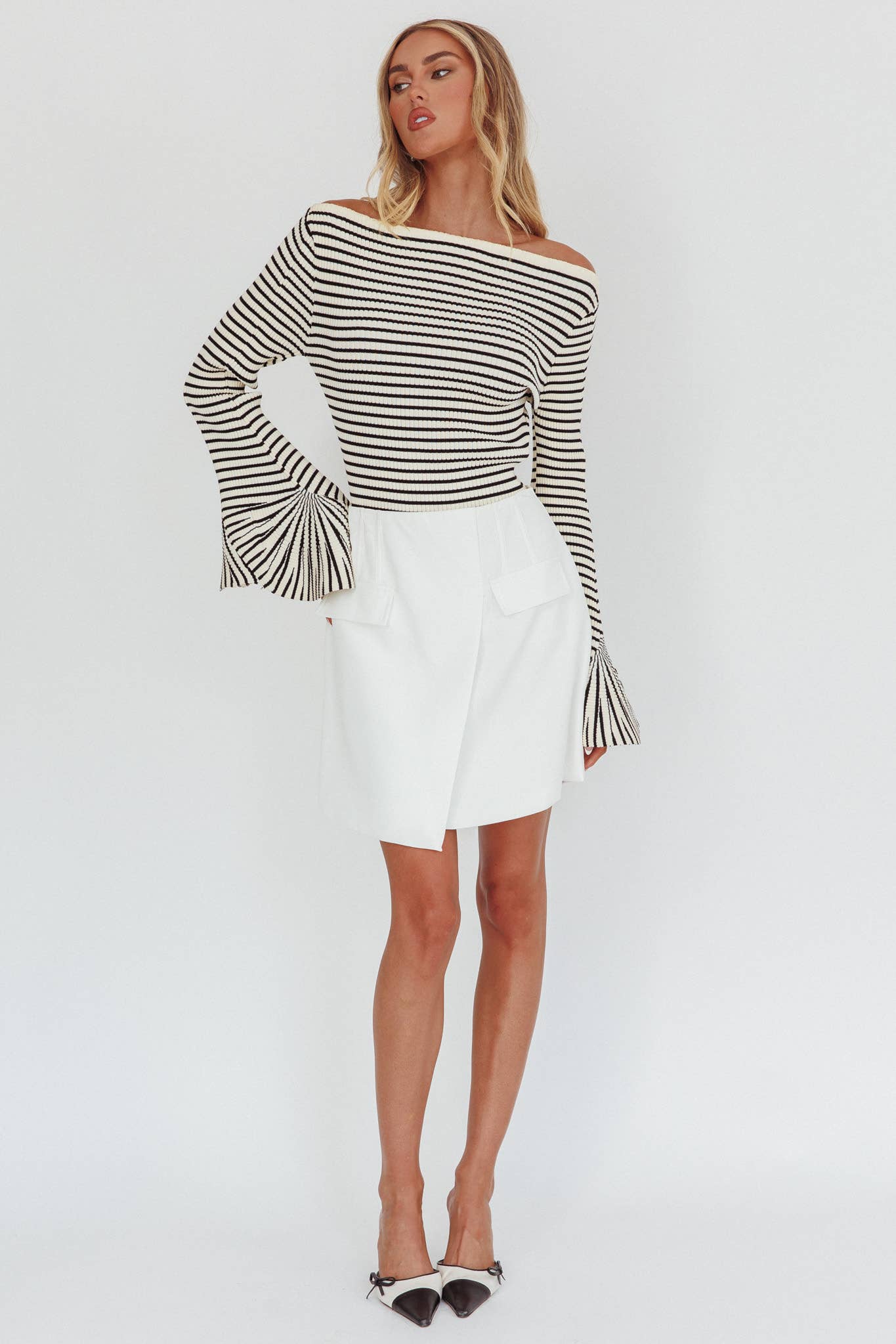 Black-and-ivory horizontal stripe sweater, ribbed, long sleeves with flare