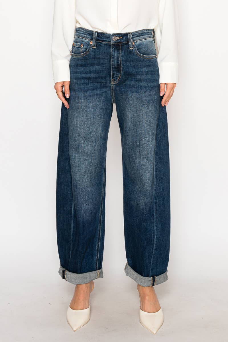 Blue jeans worn by a person on a white background