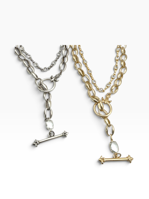 Two double-strand chain necklaces with T-bar clasp pendants, one in silver-tone metal and one in gold-tone metal, displayed on a clean white background.