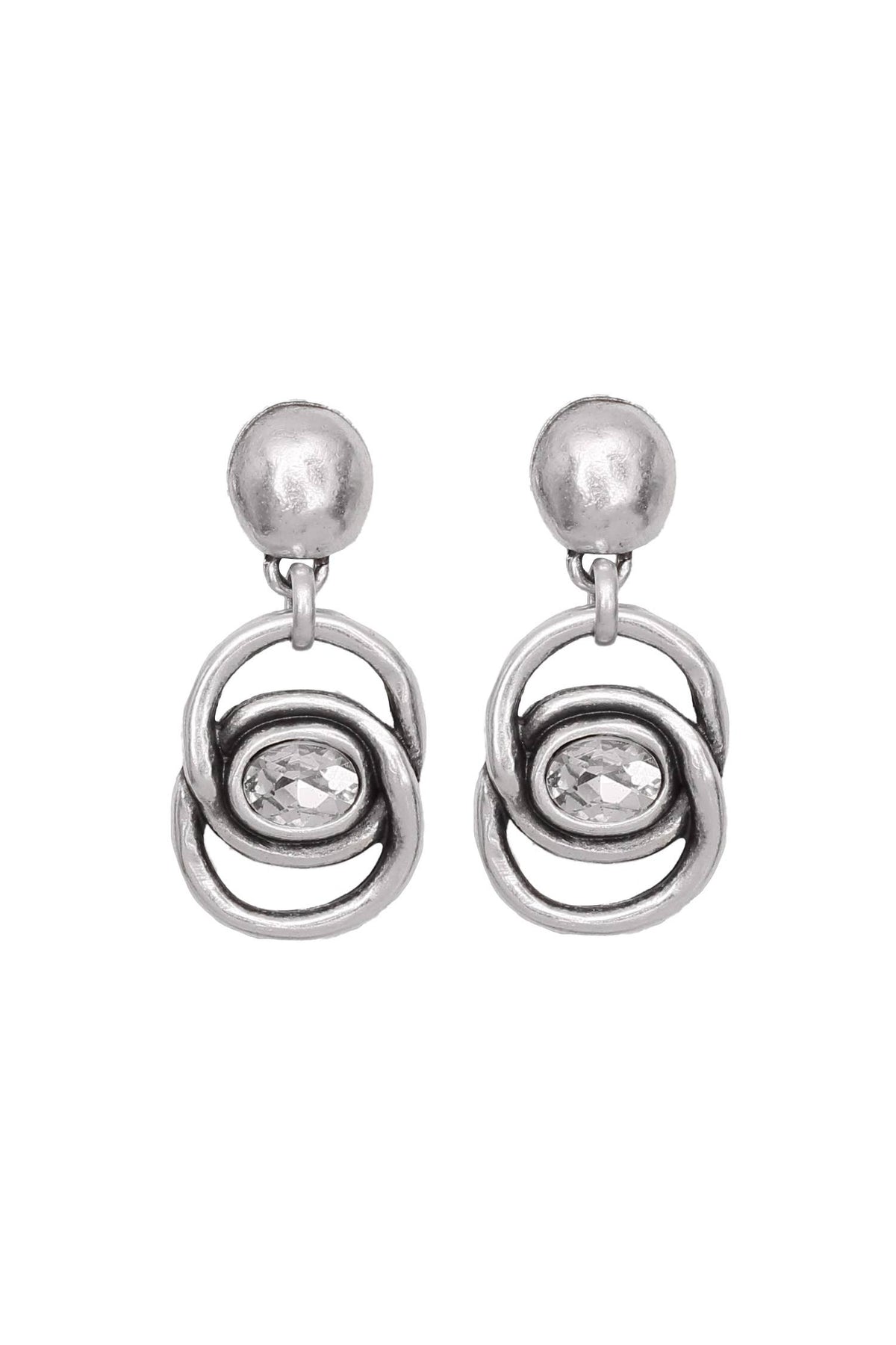 A pair of silver-toned dangle earrings with a textured spherical stud, a small clear oval gemstone, and two interlocking circular loops, shown on a plain white background.