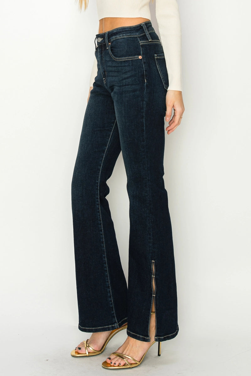 Side view—Artemis Vintage Shadow Canyon Flare high-rise dark indigo jeans with flared leg and ankle zipper split.