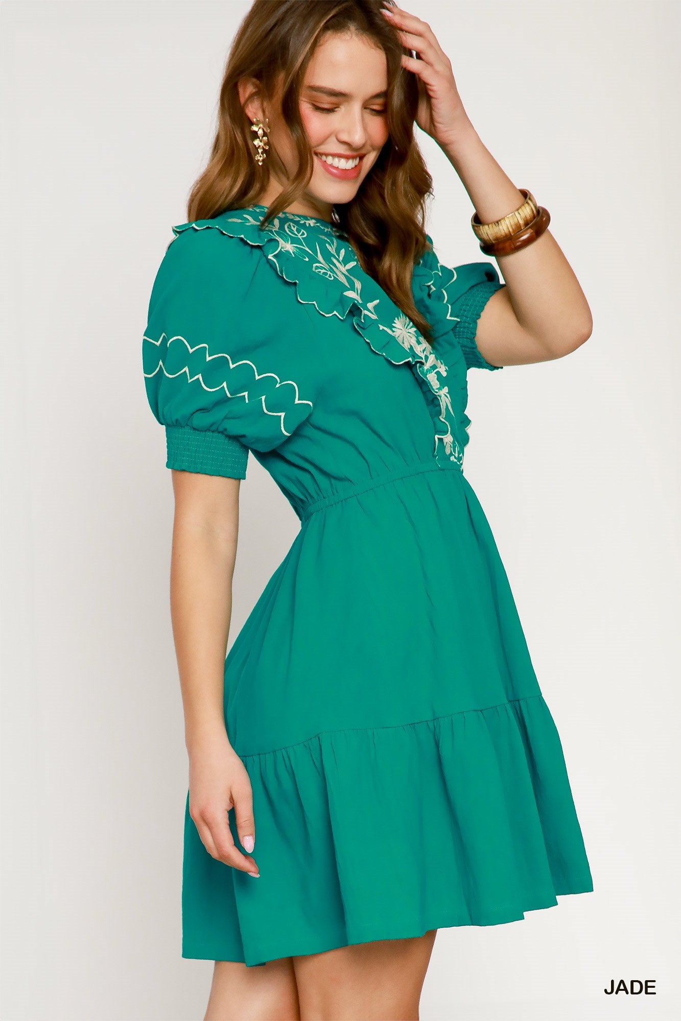 Side view of Sofia Embroidered Mini Dress in Jade – A-line silhouette with ruffle trim and embroidered detailing | Spirit & Wind Boutique
