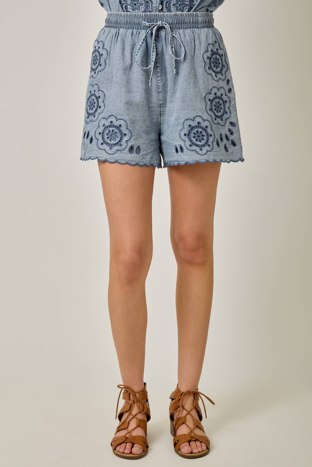 Eyelet Embroidered Washed Tencel Shorts in Dark Denim — scallop hem, drawstring waist, and boho eyelet detail

