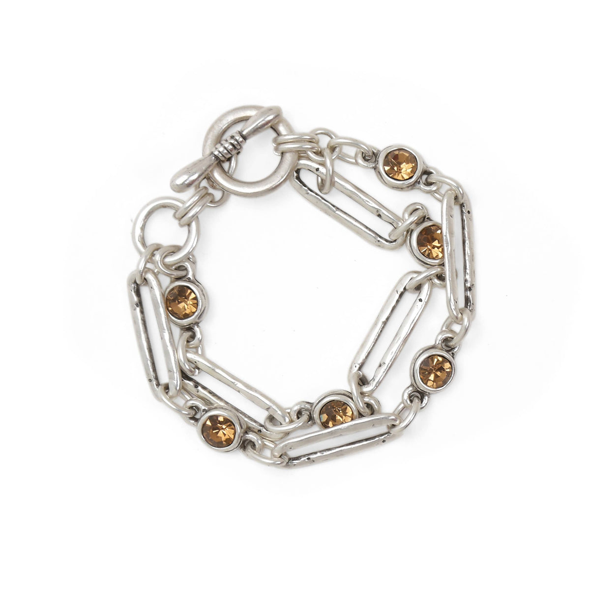 A silver-toned chain bracelet with elongated oval links and round amber-brown gemstone accents, shown on a plain white background.