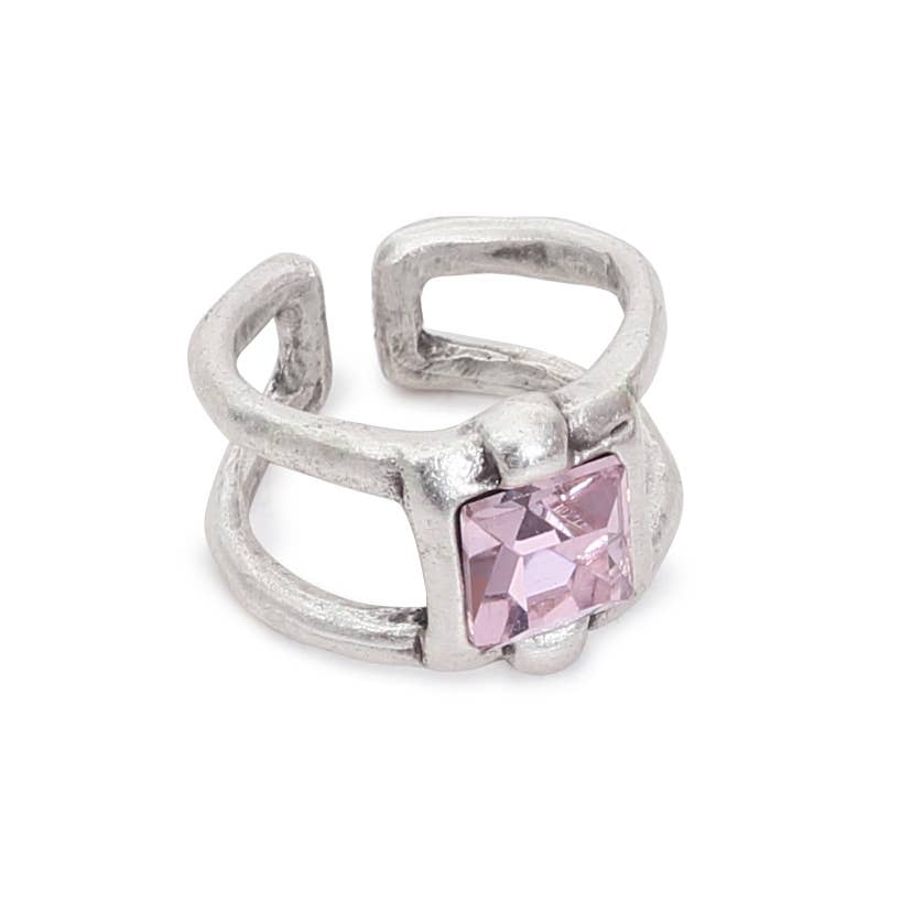 Silver ring with a pink gemstone on a white background
