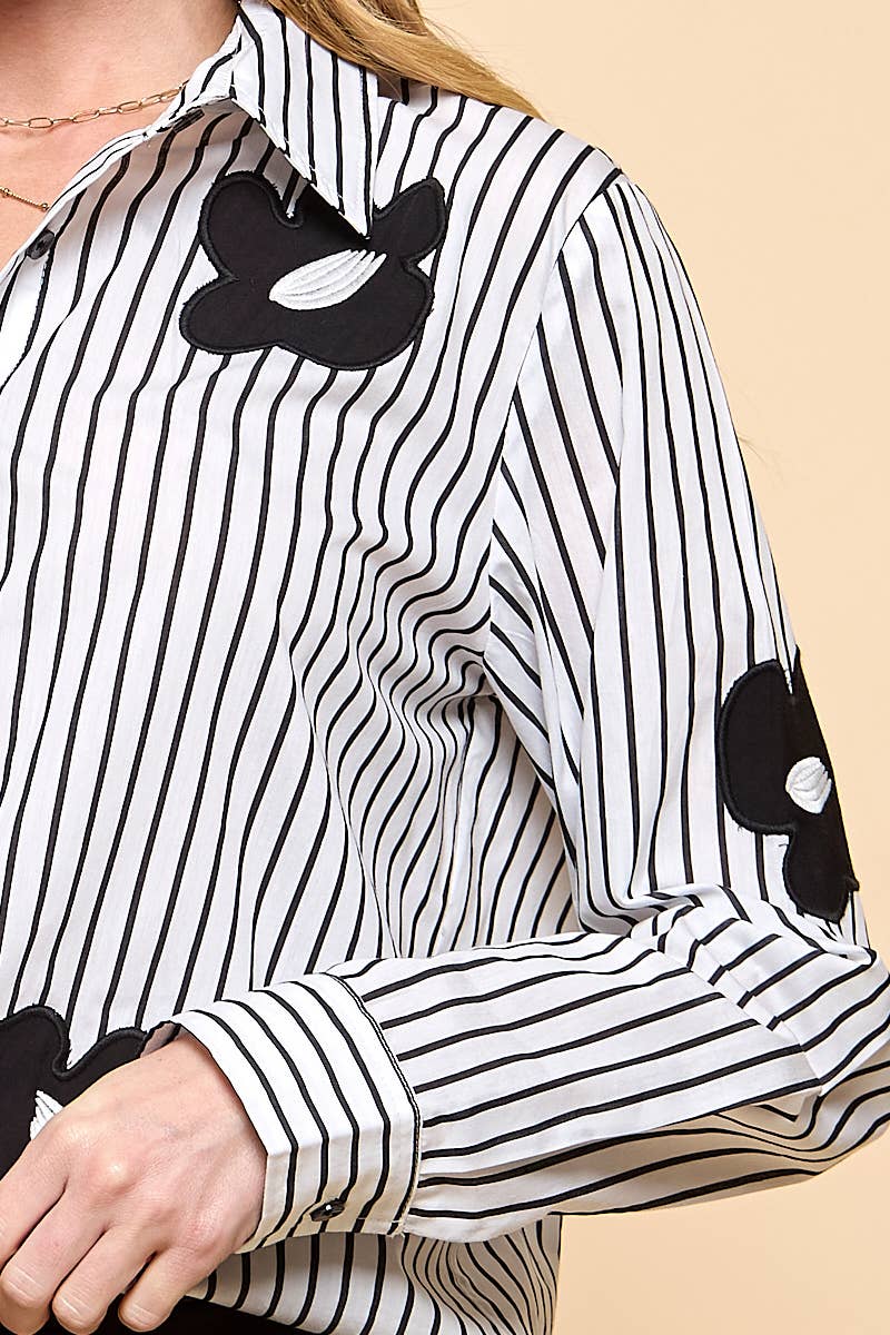 Vertical stripe collared blouse featuring black daisy accents