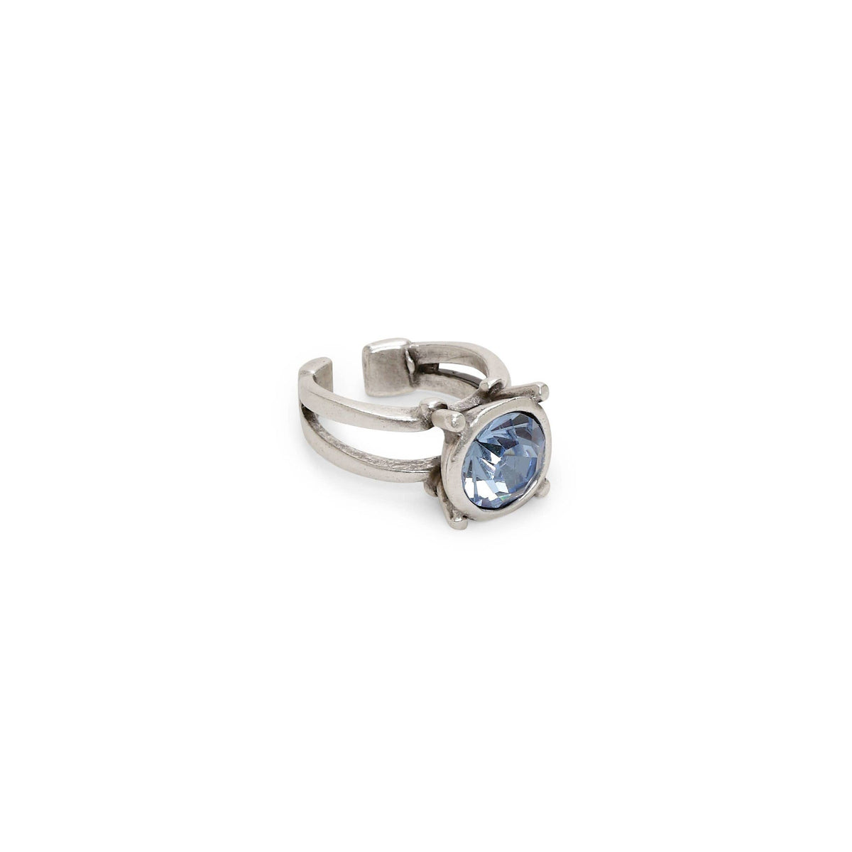 Bird-shaped charm with blue and black details on a white background