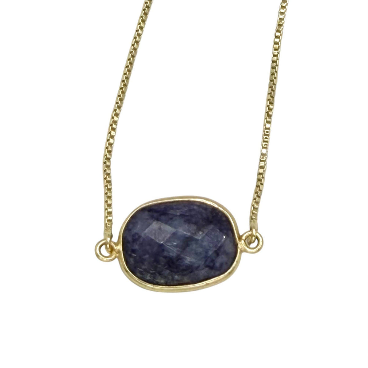 Necklace with a blue stone pendant on a white background