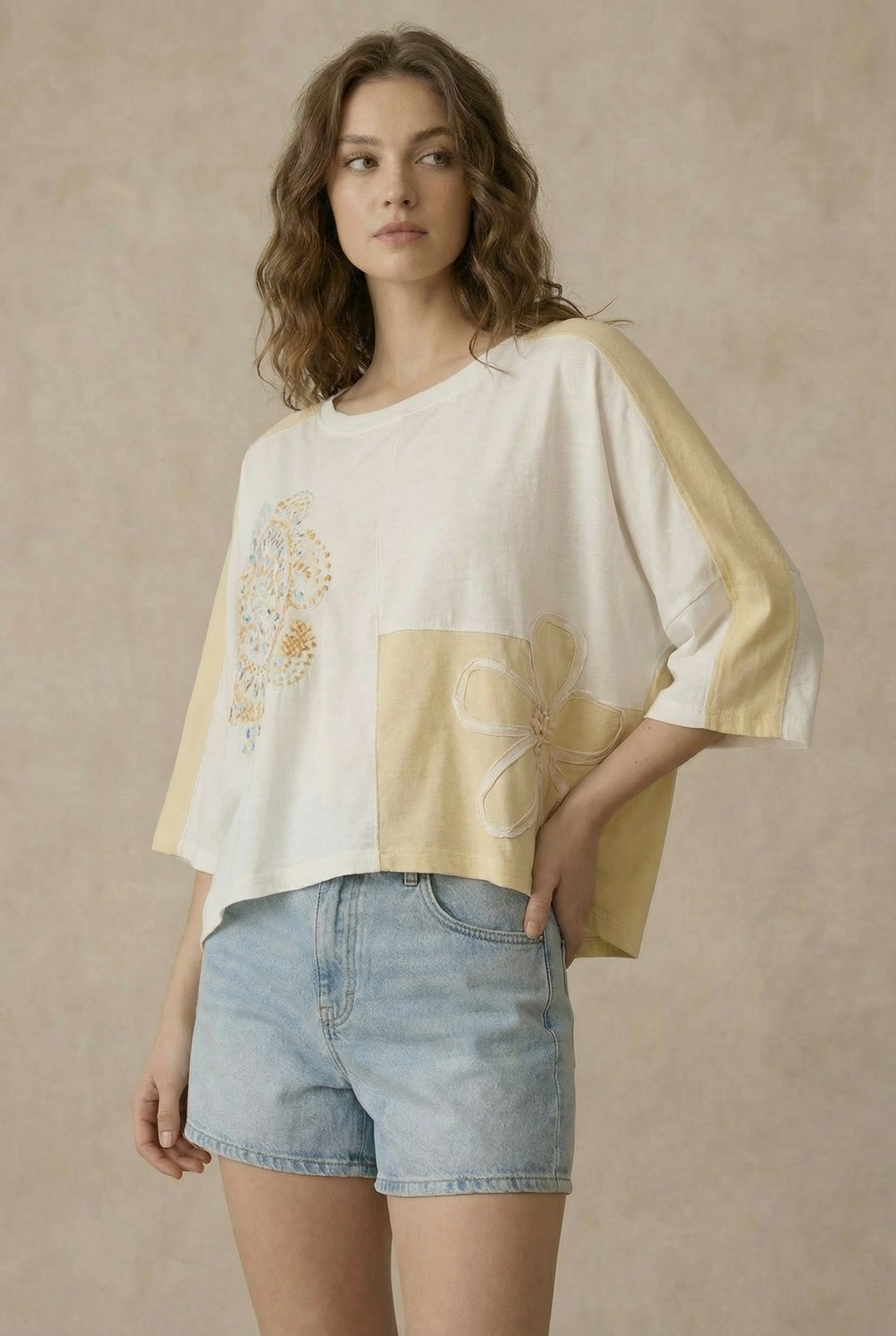 The Cleo Crochet Patchwork Top in Cream — oversized patchwork silhouette with crochet medallion patch and flower appliqué detail, boho-luxe ivory and cream colorblock top