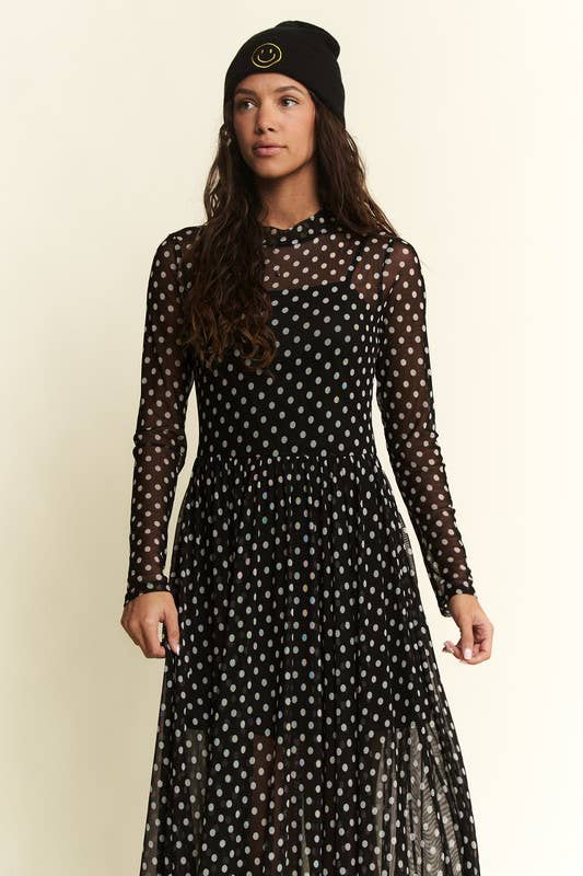 Black polka-dot mesh long-sleeve maxi dress with high neck and flowy, sheer overlay.