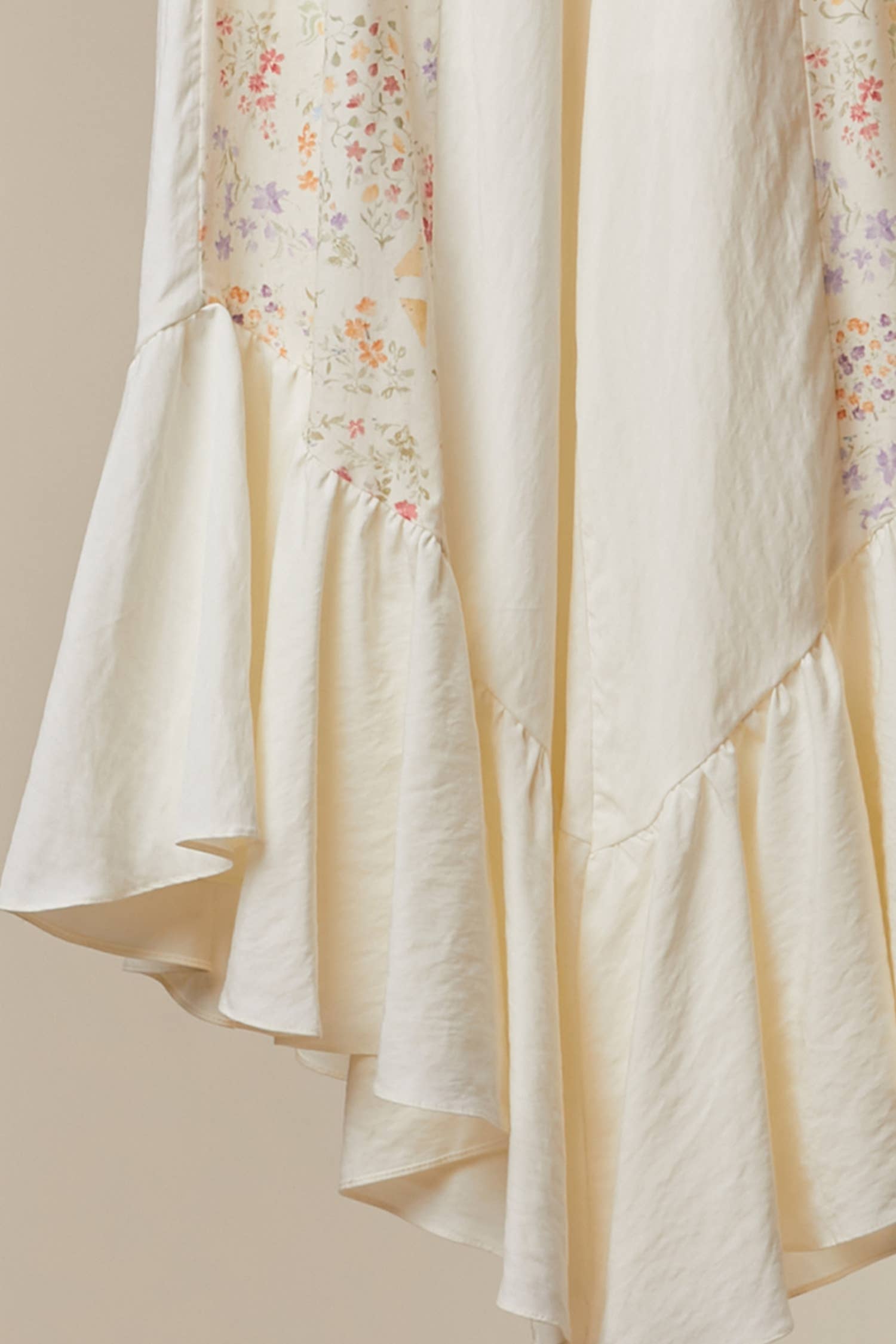 Floral ruffle pants detail shot - artisan patchwork construction with whimsical romantic accents