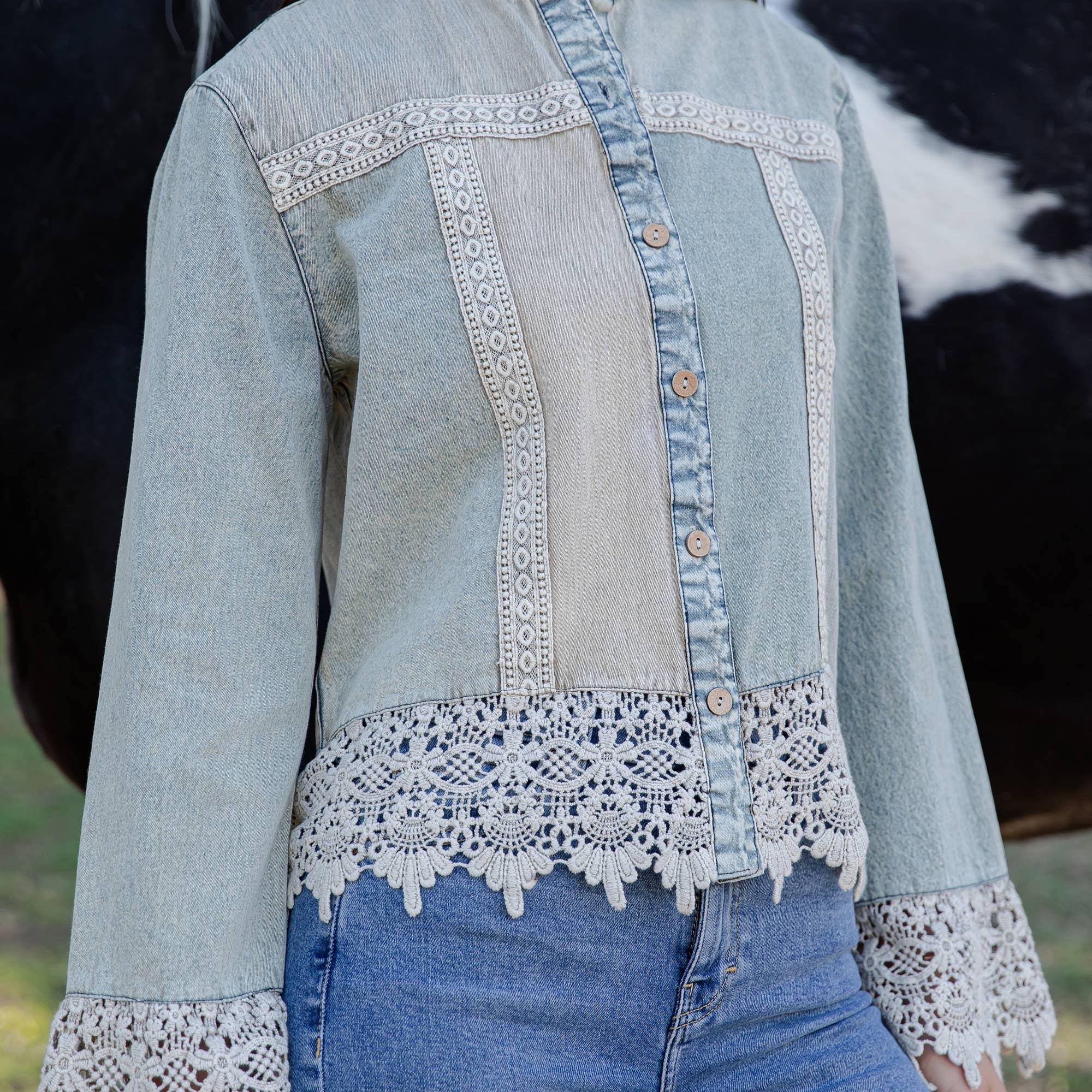 The Havannah Lace Trim Denim Top - detail shot of button closure and lace trim