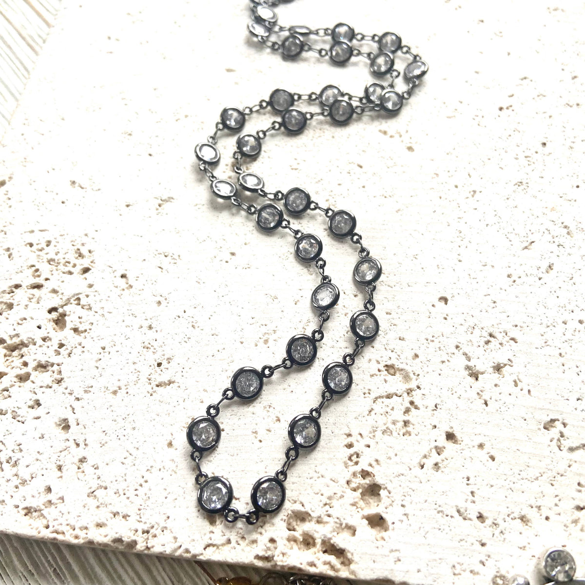 Gunmetal Clear Crystal Layering Boutique Necklace pairs luminous clear crystals with a gunmetal finish