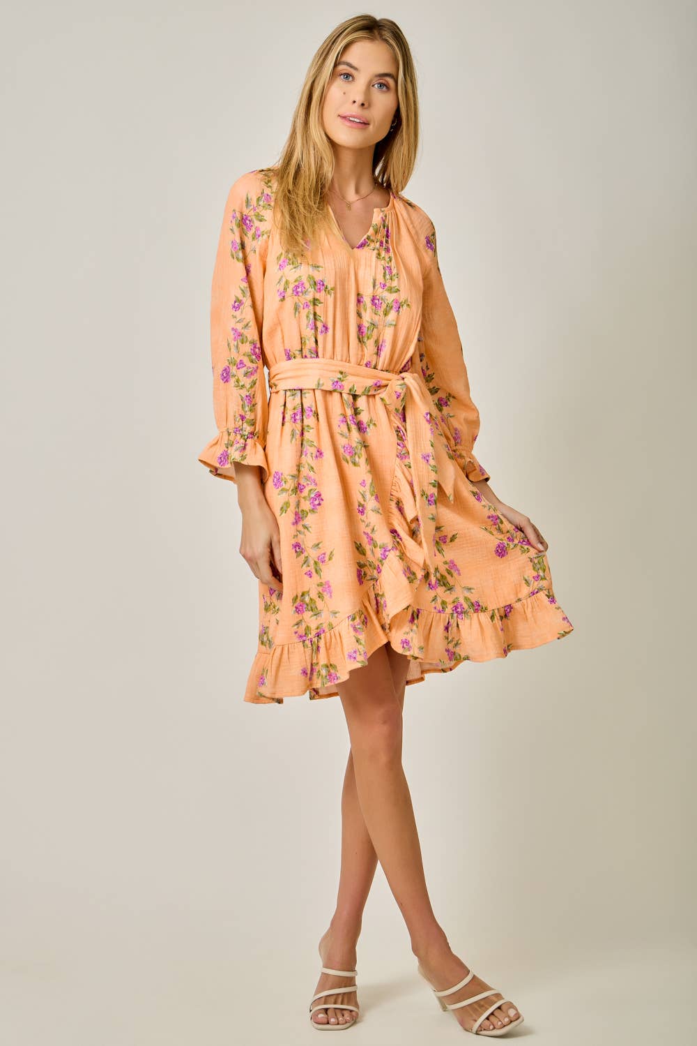 The Valencia Floral Wrap Dress - detail of adjustable waist tie and ruffle trim

