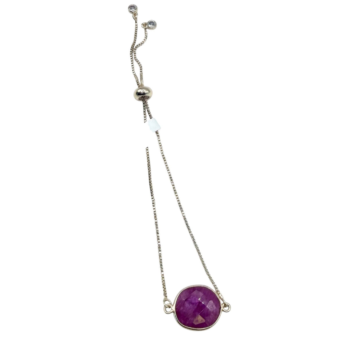 Bracelet with a purple gemstone on a white background