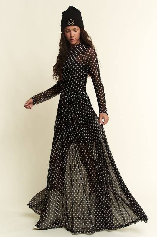 Black polka-dot mesh long-sleeve maxi dress with high neck and flowy, sheer overlay.