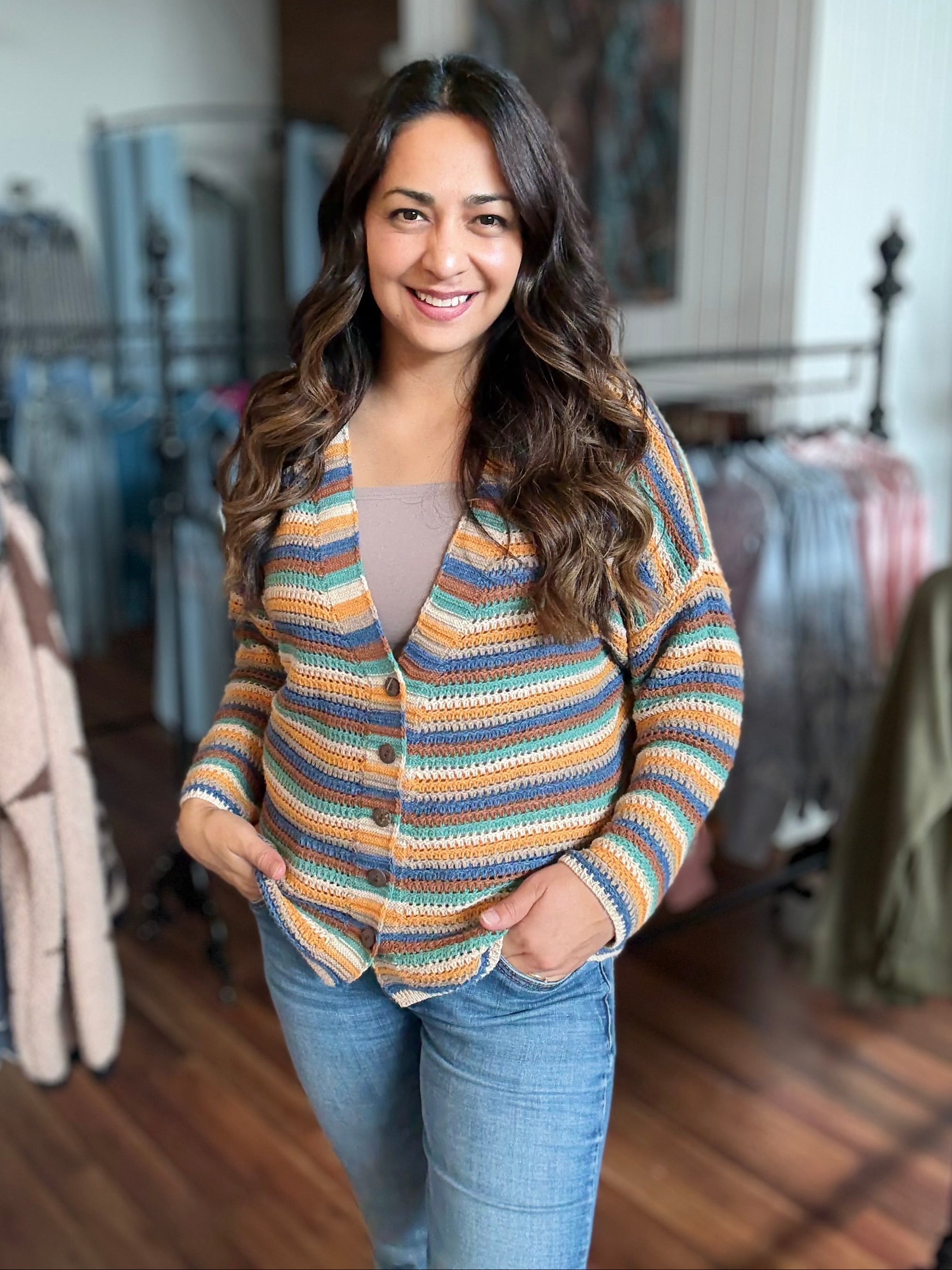 Woman wearing a striped sweater in a clothing store