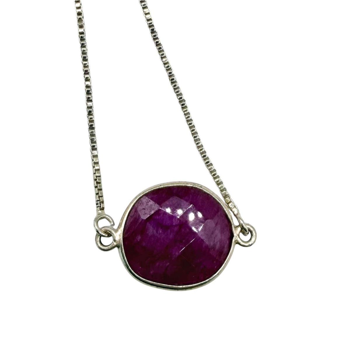 Necklace with a purple gemstone pendant on a white background