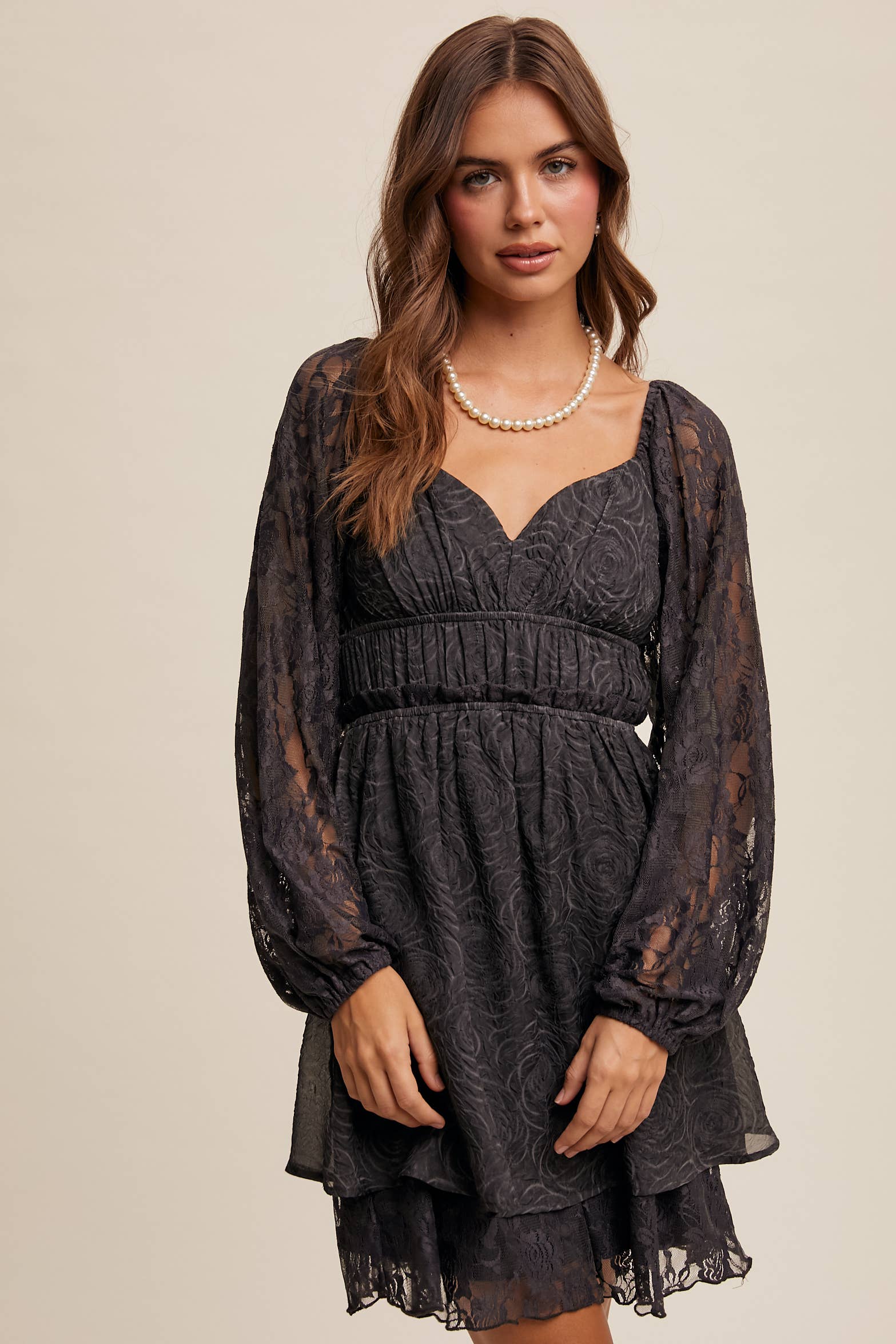 Close-up of floral lace detailing and layered hem on The Midnight Lace Dress