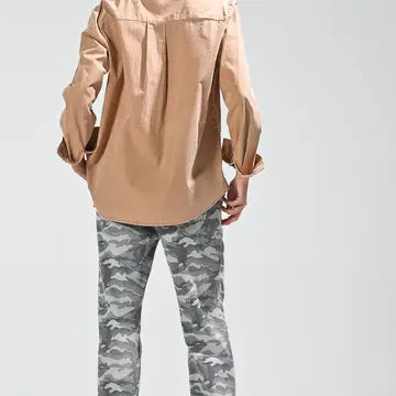 Back view showing relaxed fit and long sleeves