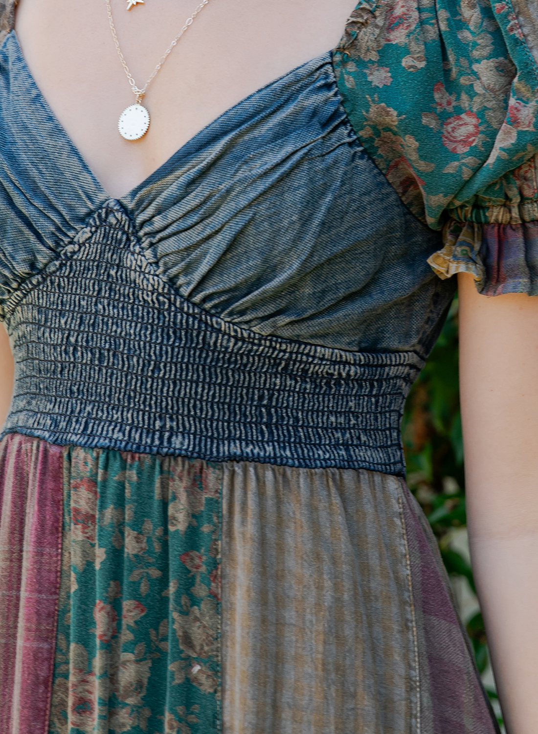 The Wildflower Sweetheart Patchwork Dress - Close up view highlighting asymmetrical skirt with denim frills in Gravel Color
