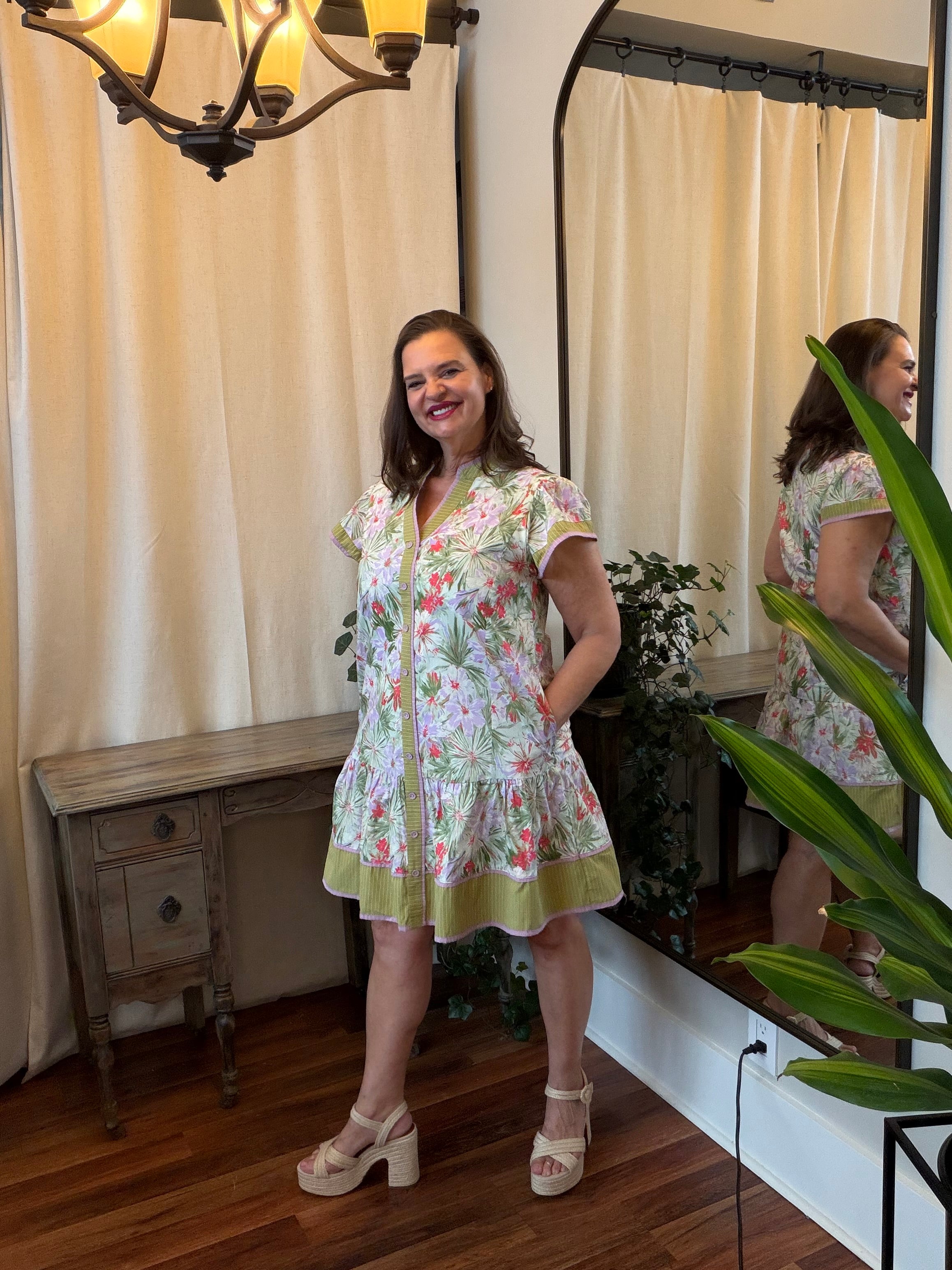 Tropical Floral Tiered Dress - full-length view showing lined tiered skirt, flutter sleeve detail, and tropical floral print with contrast trim
