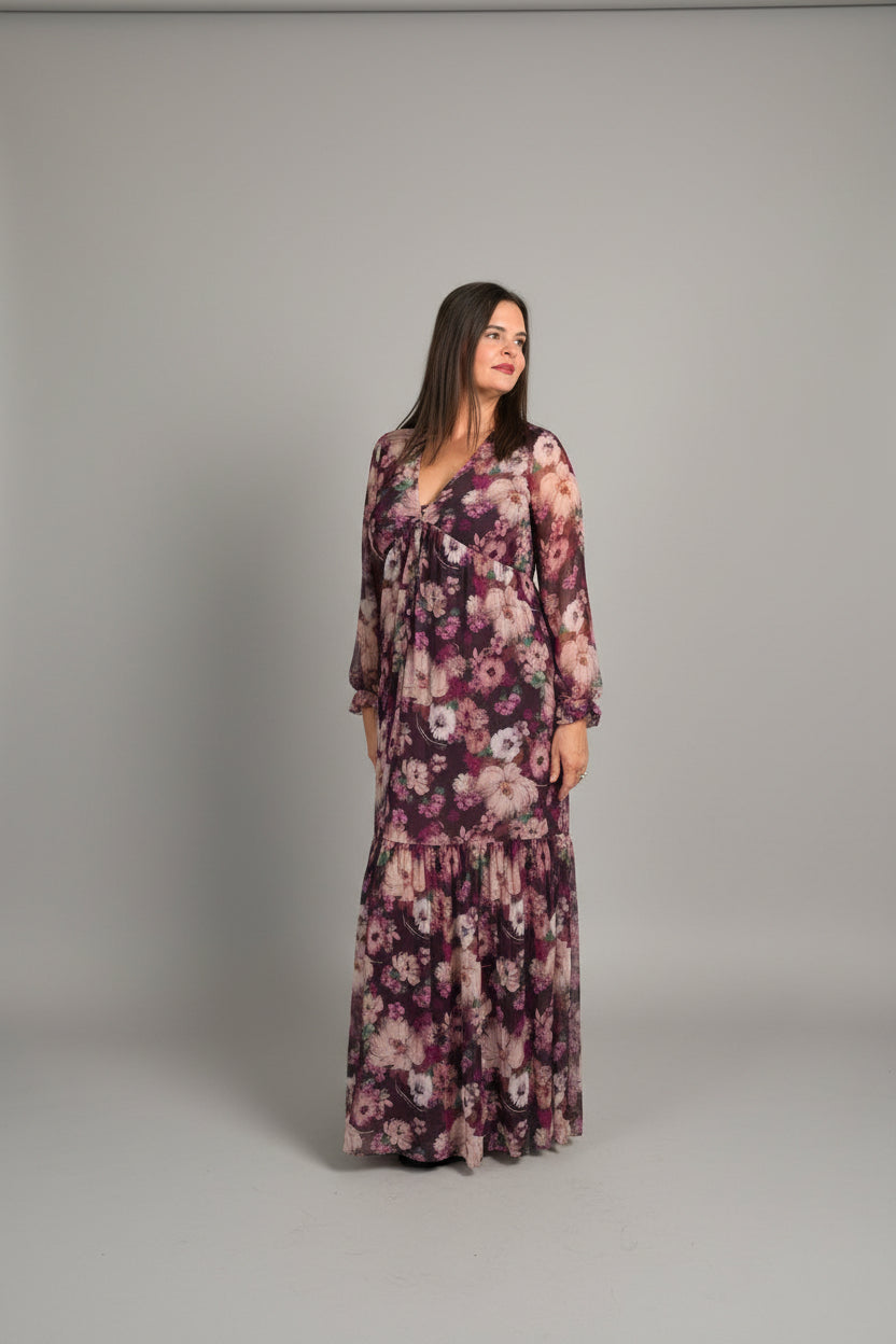 Woman smiling outside Spirit & Wind Boutique storefront wearing burgundy floral button-down maxi dress, lifestyle outdoor shot
