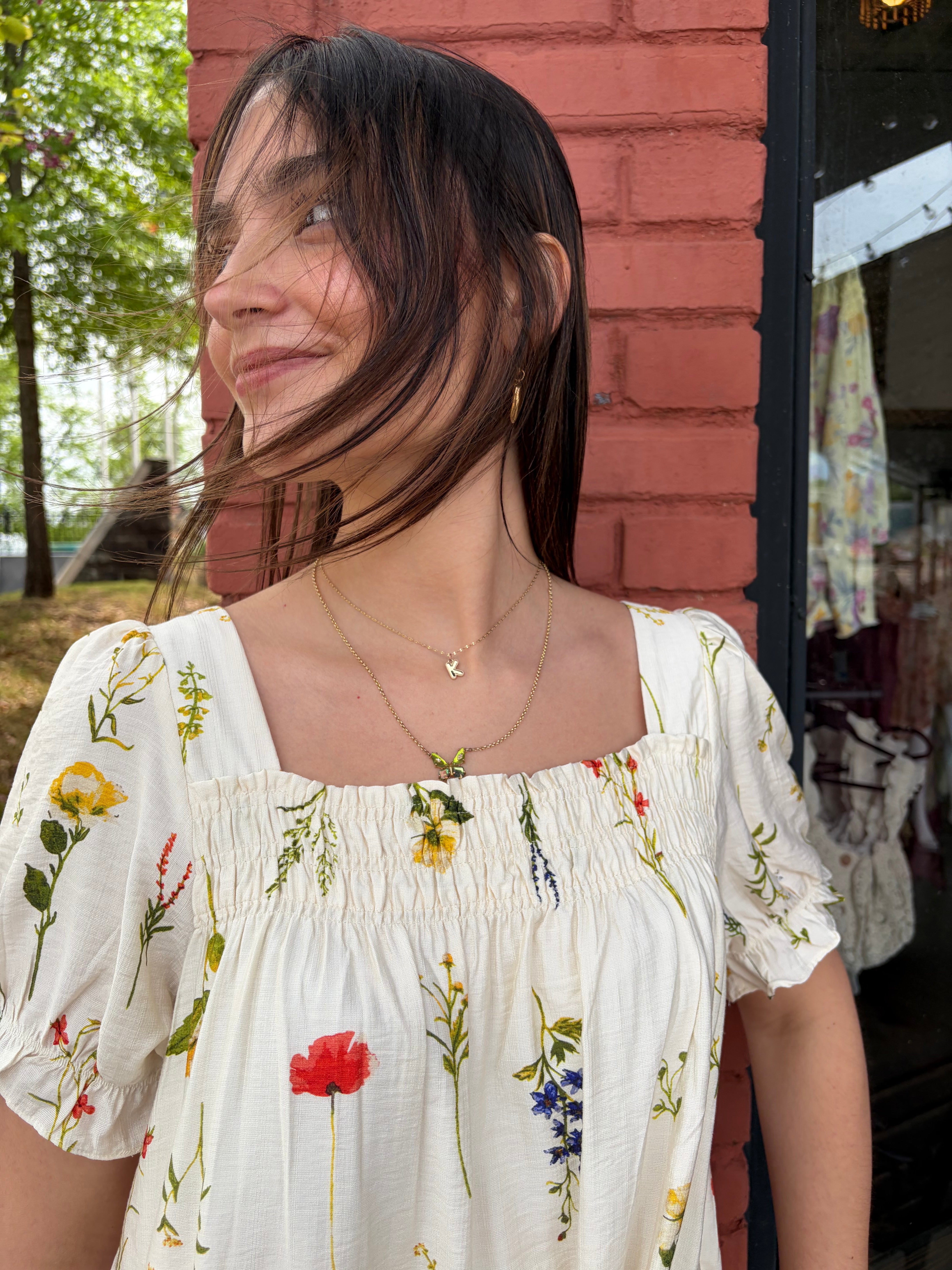 Close up picture of Breezy Days White floral mini dress 