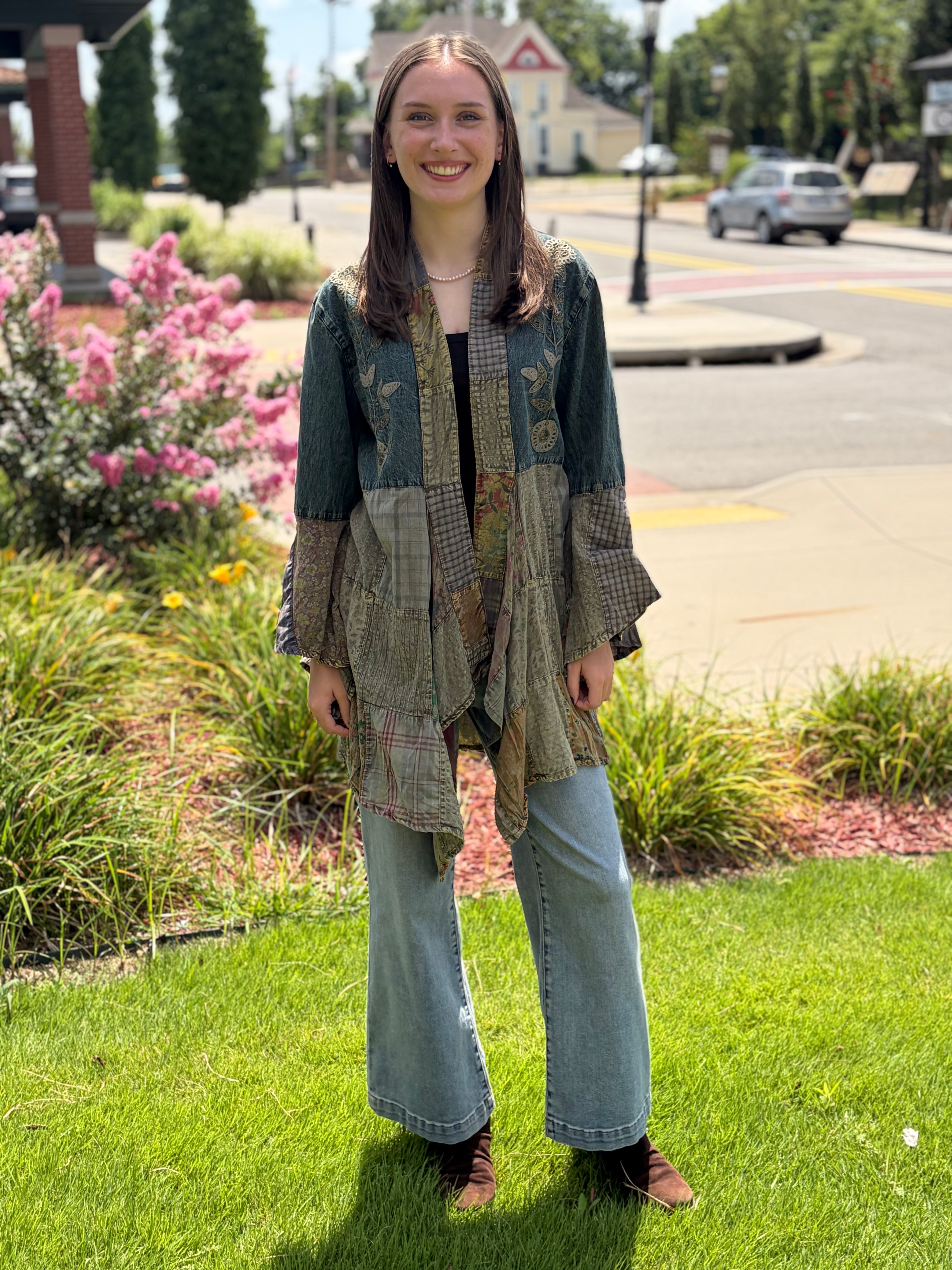 Outdoor full-body front, smiling model, wide-leg jeans