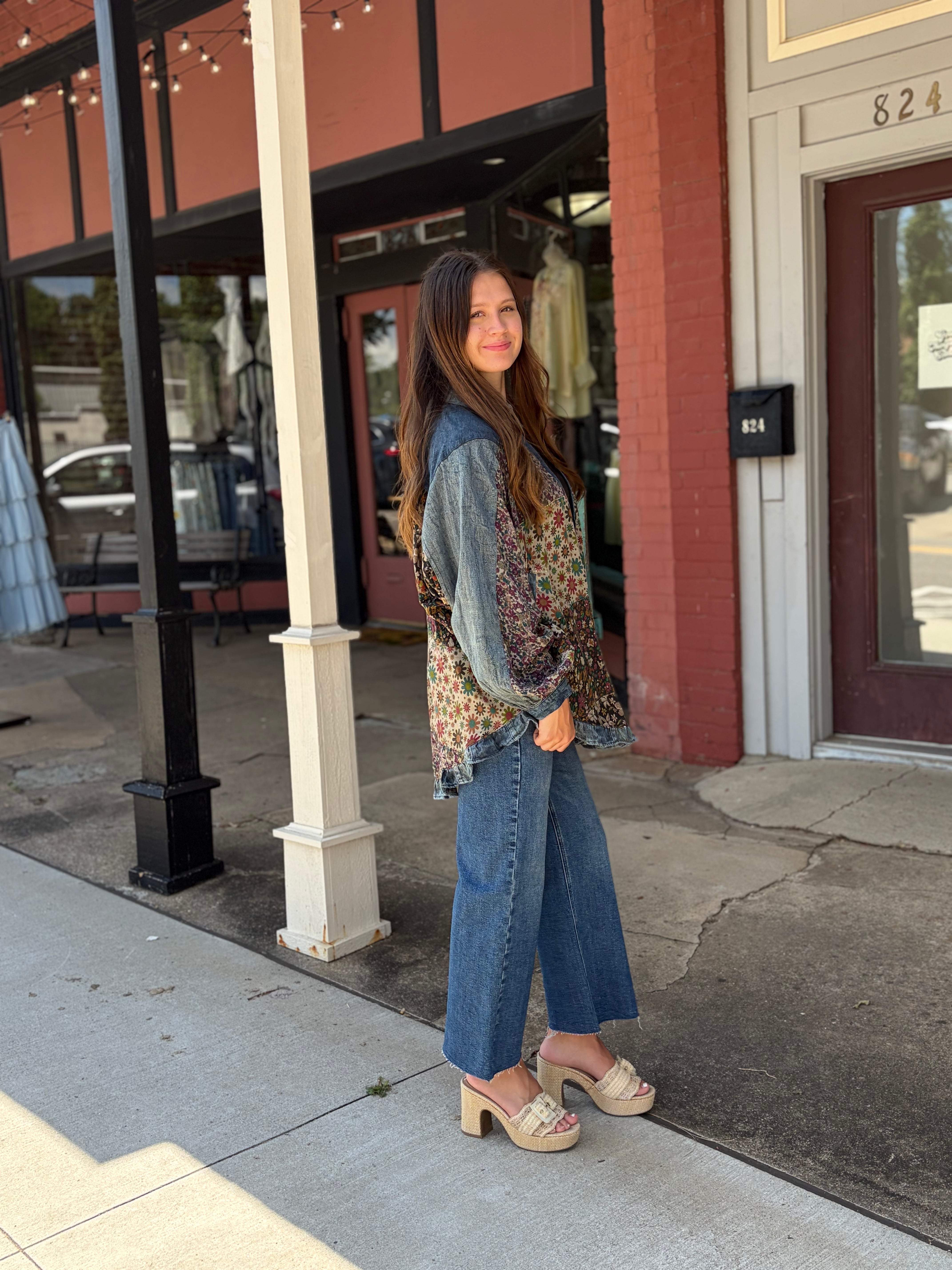 Outdoor side glance, denim yoke + mixed floral panels, wide-leg jeans + platform mules