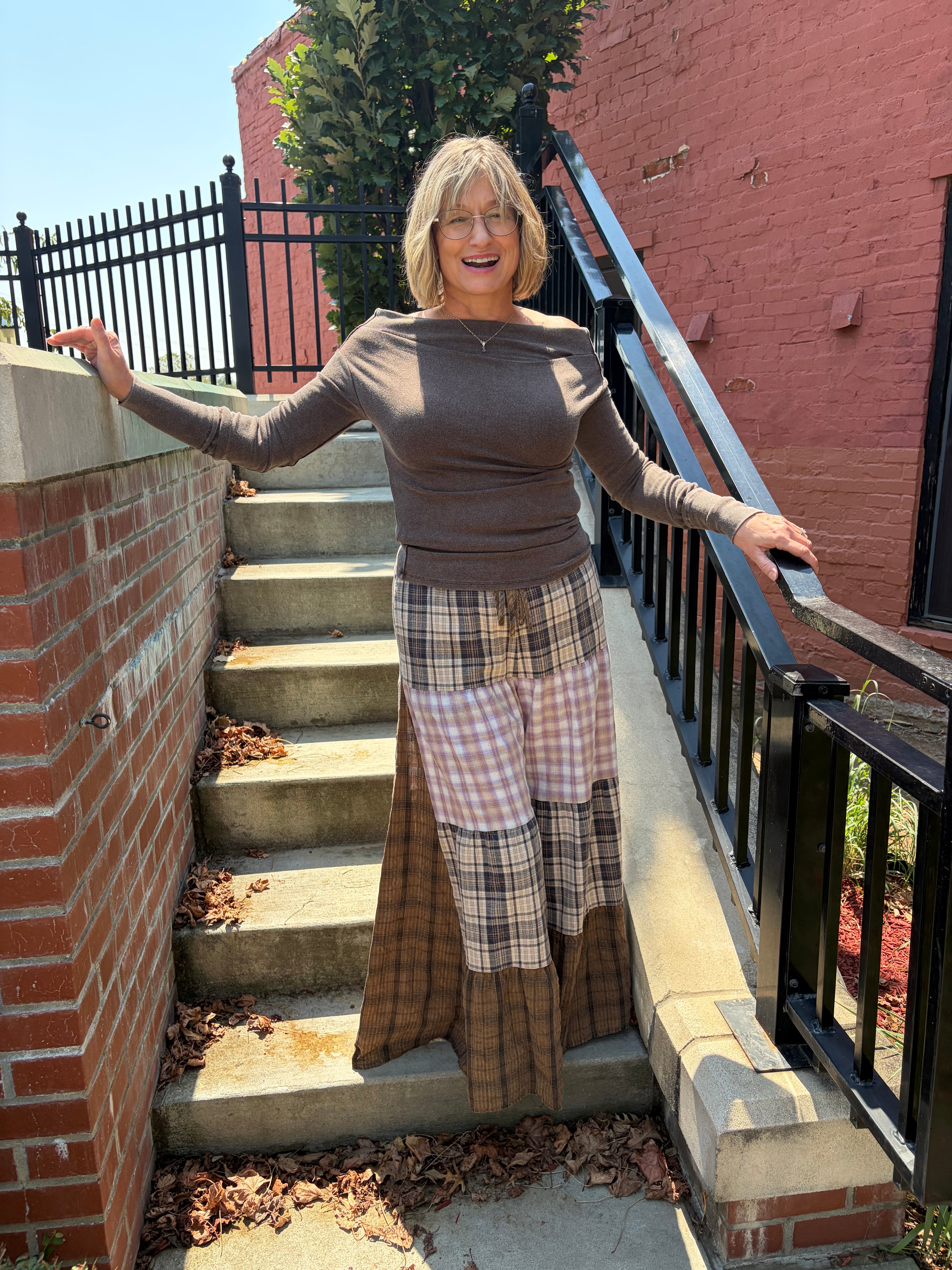 Patchwork Plaid Maxi Pants in mixed brown plaid patchwork, wide leg fit, outdoor lifestyle shot
