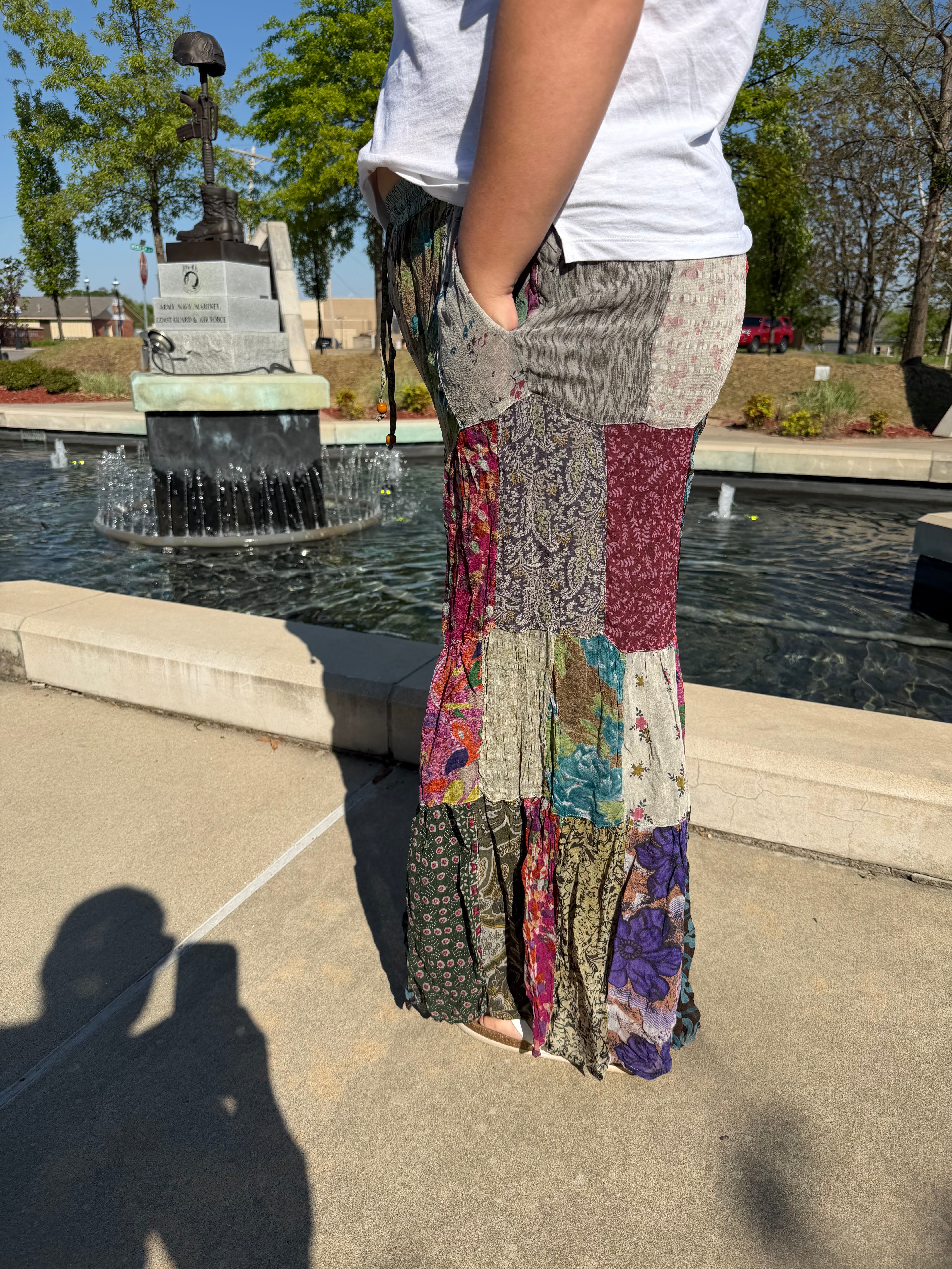 Retro Revival Patchwork Flare Pants Plus – Side view of grey patchwork georgette flare pants with side pockets | Spirit & Wind Boutique