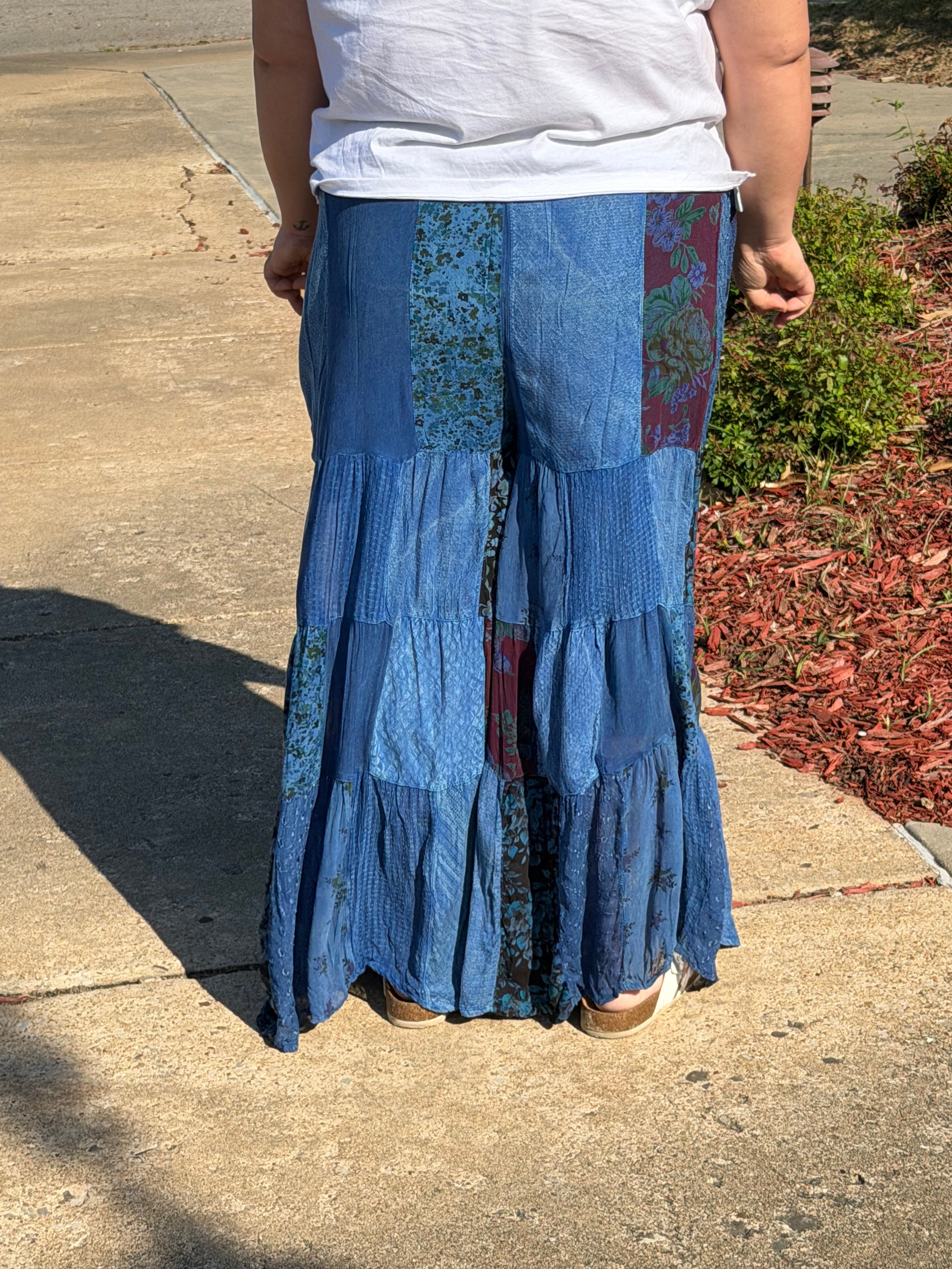 Woman wearing indigo patchwork bottoms