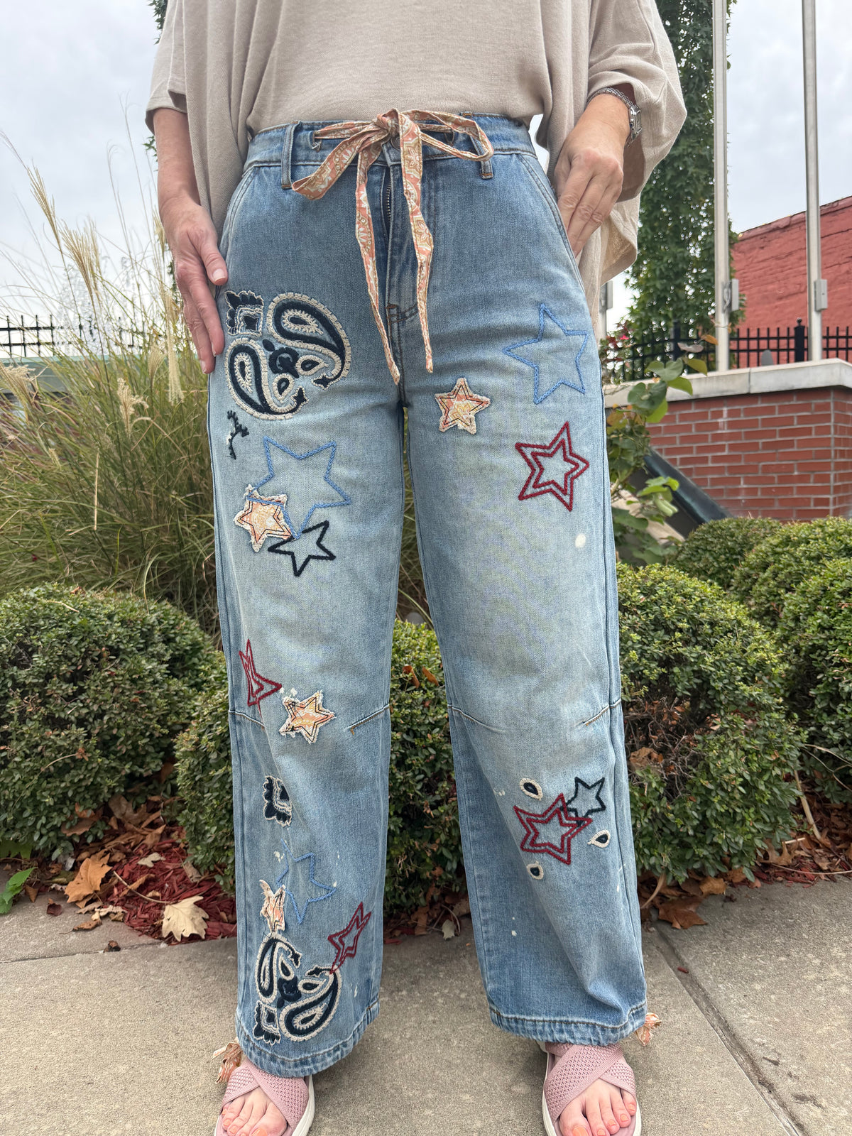 Oli & Hali washed denim pants with star and paisley embroidery
