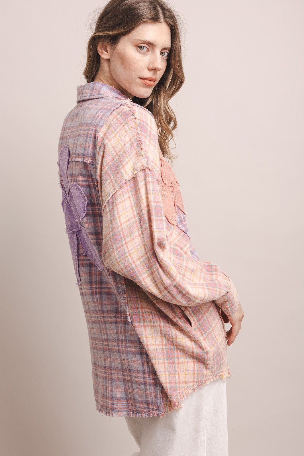 Back three-quarter, color block panels, raw-edge seams, frayed hem