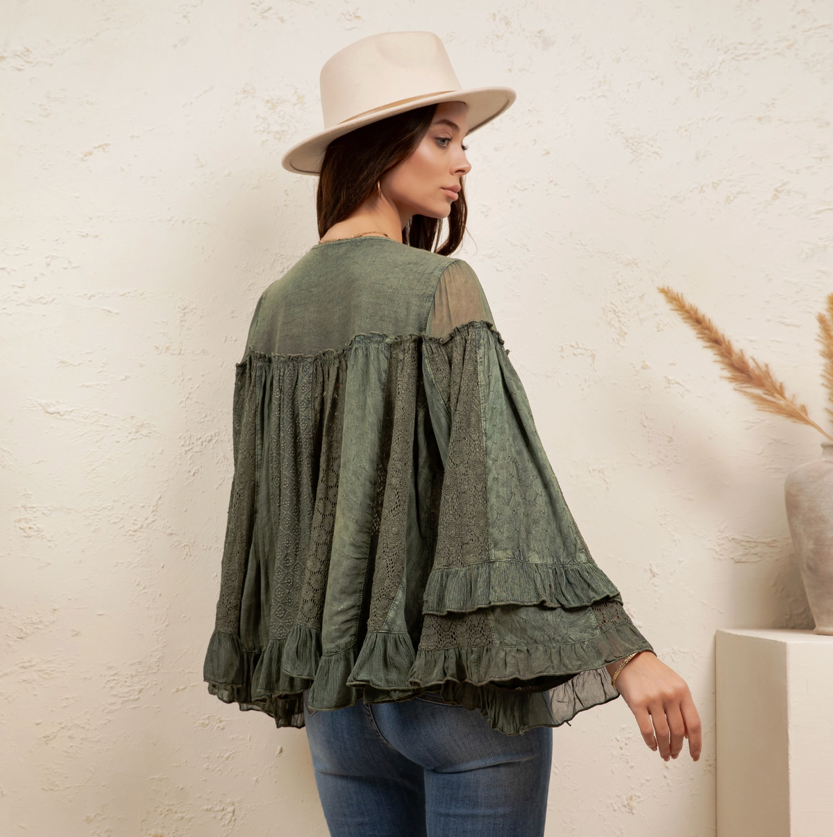 back view) — lace texture, tiered ruffle hem, bell sleeves