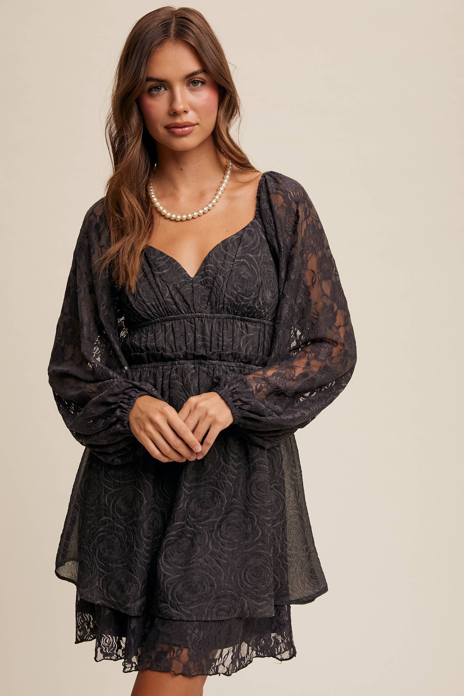 Close-up of floral lace detailing and layered hem on The Midnight Lace Dress