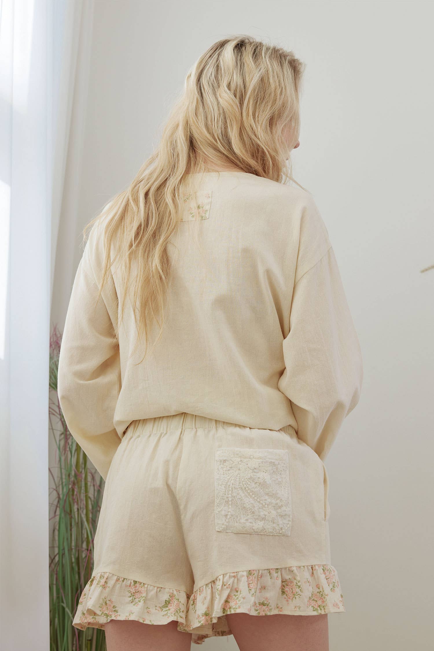 Frilled floral shorts back view - whimsical romantic design with artisan detailing and flattering fit