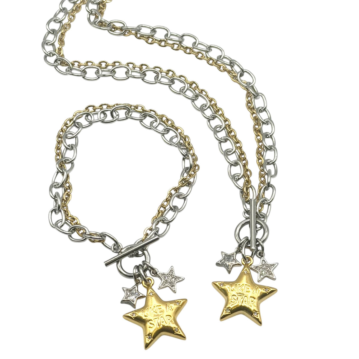 Necklace: Mixed-metal necklace & bracelet with silver- and gold-tone chains, a toggle clasp, two small silver stars, and a gold star engraved “Like a Star.”

