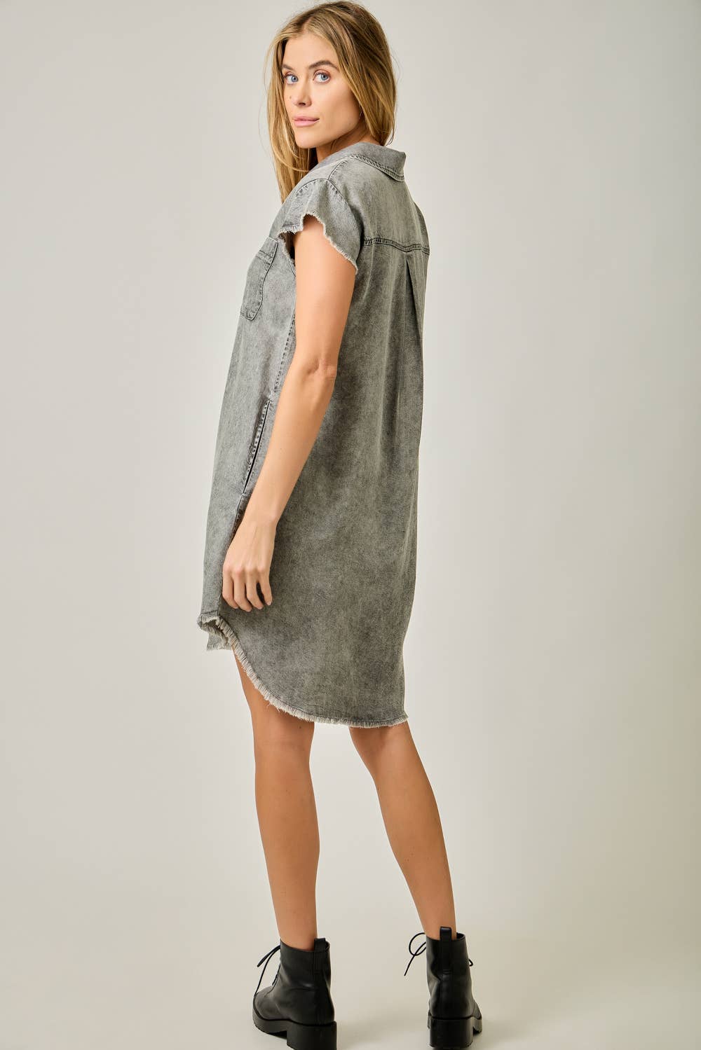 Back view Flutter Sleeve Fringe Hem Tencel Shirt Dress in Washed Black — button-down front, flutter cap sleeves, fringed hi-lo hem, and side pockets

