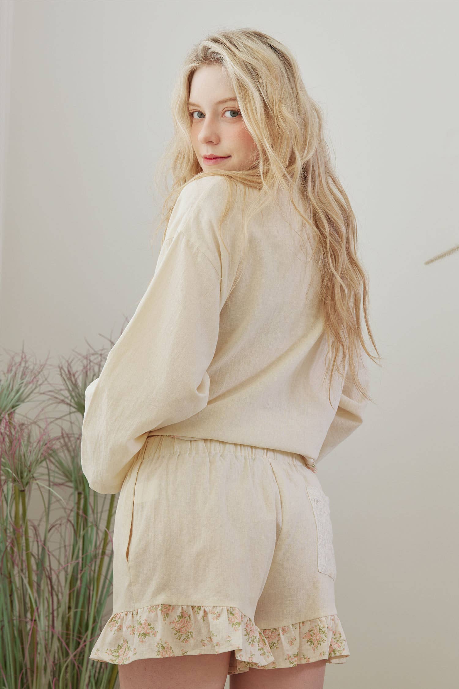 Frilled floral shorts back view - whimsical romantic design with artisan detailing and flattering fit