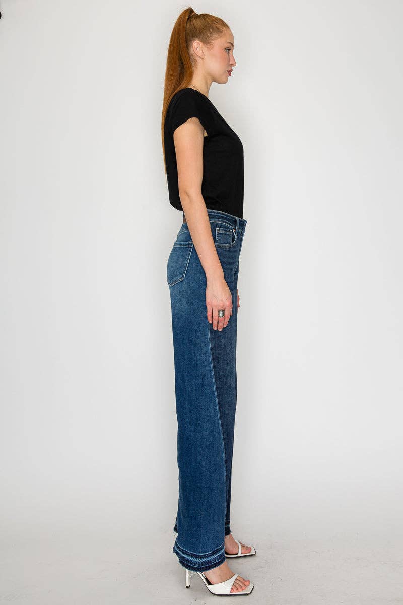 Wide flare jeans side angle - leg-lengthening silhouette with structured flare and premium stretch denim