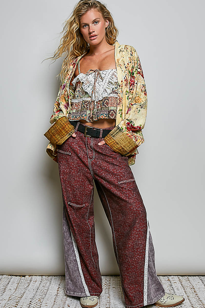 Full view of a woman wearing the Peace in Bloom yellow multi floral reversible boho jacket ⠋