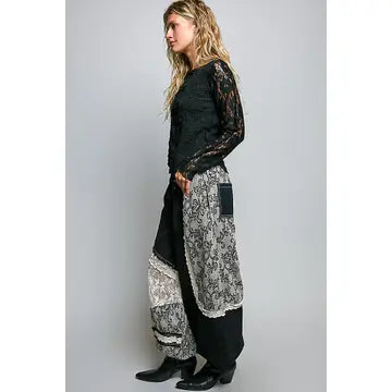 Side full-length — relaxed wide-leg silhouette, lace overlay, side profile